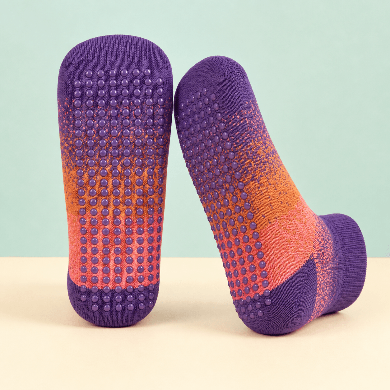 Colorful custom grip socks with silicone dots across the soles