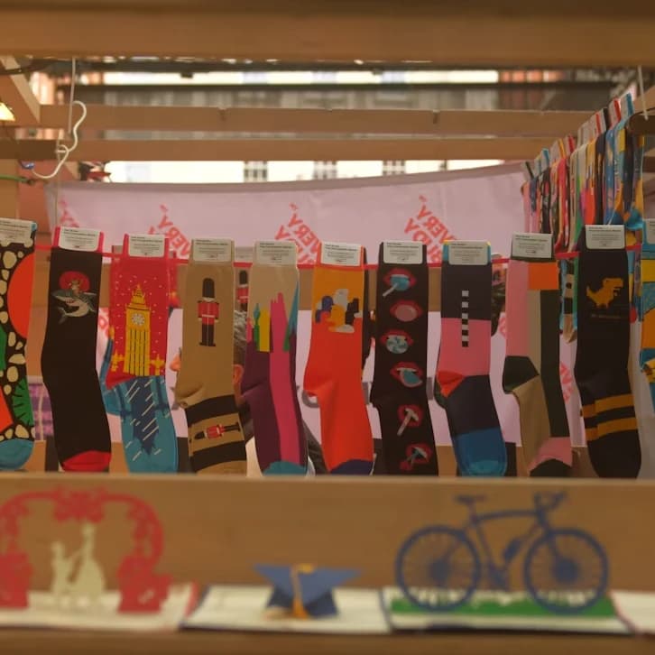A display of colorful socks hanging in a shop